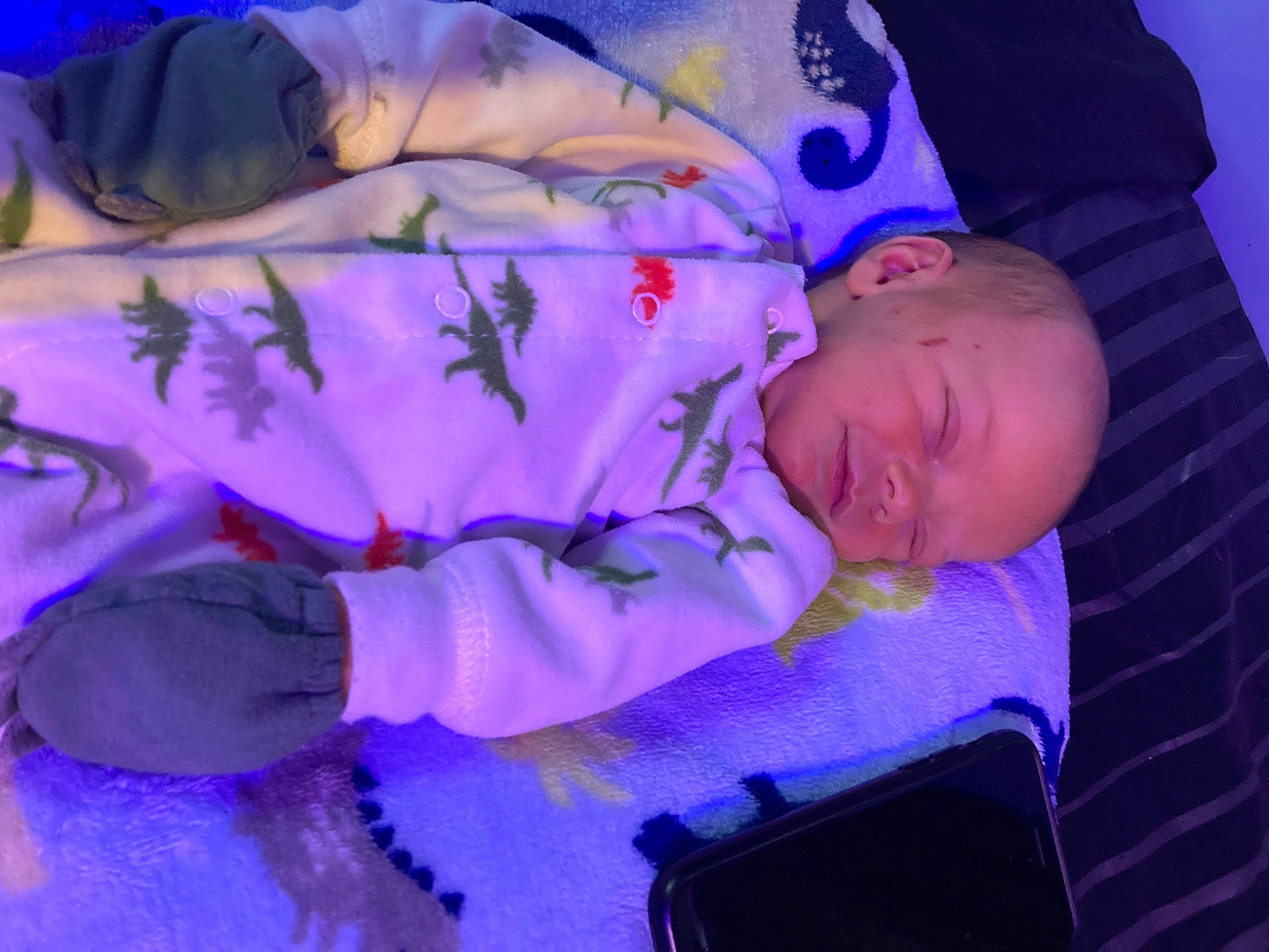 Brian is registered to the contest to win money with this photo: baby, baby_products, baby_toddler_clothing, bedtime, child, comfort, electric_blue, event, fun, lighting, linens, magenta, pattern, person, pink, purple, room, textile, toddler, tree