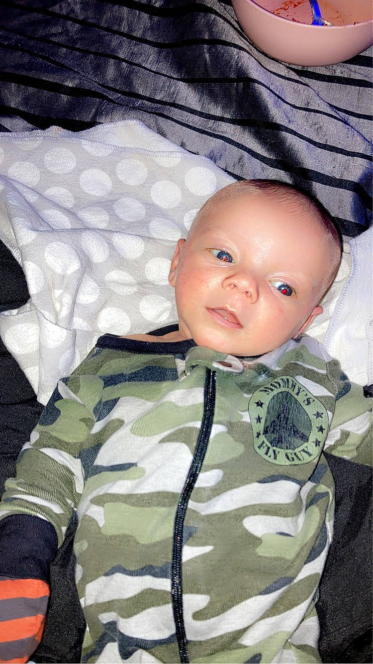 Brian Lee is registered to the contest to win money with this photo: baby, baby_products, baby_toddler_clothing, camouflage, cheek, child, comfort, eye, eyelash, facial_expression, head, iris, military_camouflage, military_uniform, pattern, person, sitting, sleeve, toddler, uniform