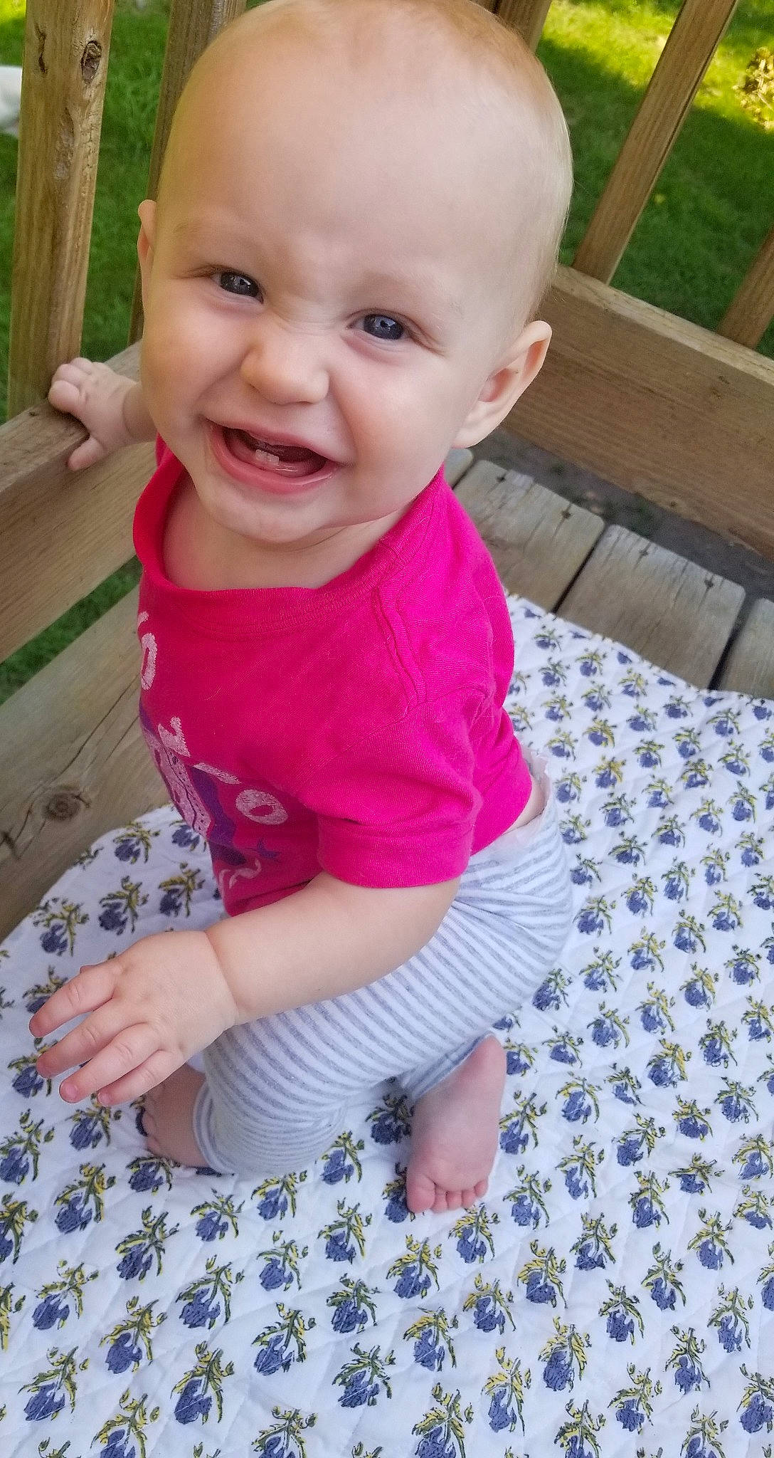 Emmy is registered to the contest to win money with this photo: baby, baby_toddler_clothing, cheek, child, design, face, facial_expression, head, joy, lip, nose, pattern, person, pink, play, skin, smile, toddler