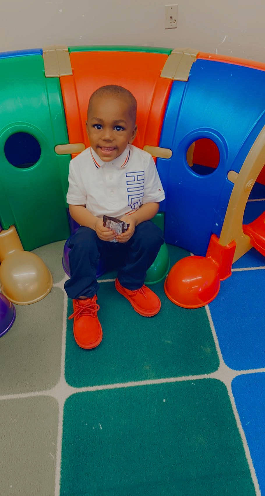 Taylin joined the competition — help win amazing prizes! baby, blue, child, electric_blue, floor, flooring, fun, green, joy, leisure, person, photograph, plastic, play, recreation, red, sitting, smile, snapshot, t_shirt