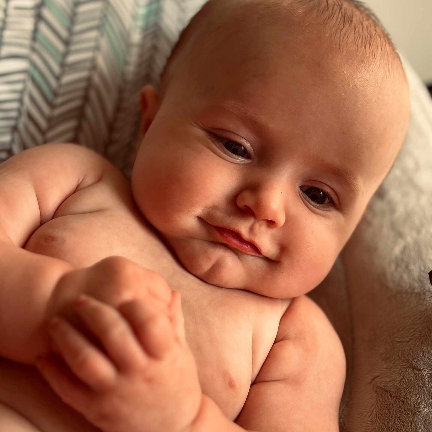 Jesse is registered to the contest to win money with this photo: baby, babylaughing, biting, bodypart, face, finger, hand, happy, head, newborn, person, photography, portrait, smile, wrist