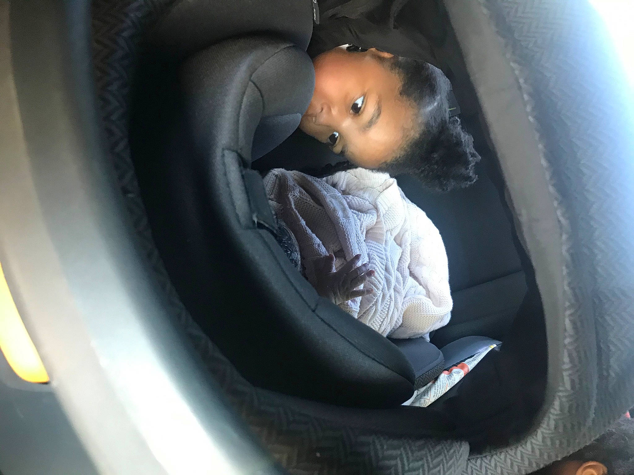 Zariah is registered to the contest to win money with this photo: auto_part, car_seat, car_seat_cover, comfort, person