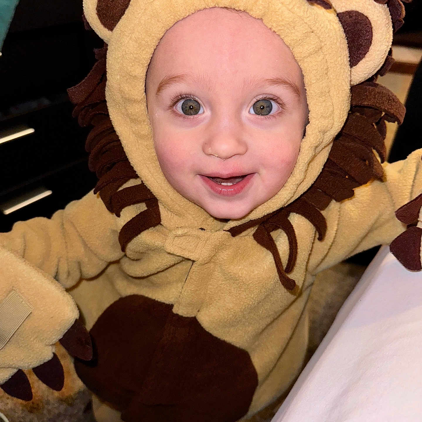 Jayse is registered to the contest to win money with this photo: baby, bonnet, cap, clothing, coat, costume, face, glove, happy, hat, head, hood, hoodie, jacket, knitwear, person, photography, portrait, sweater, sweatshirt