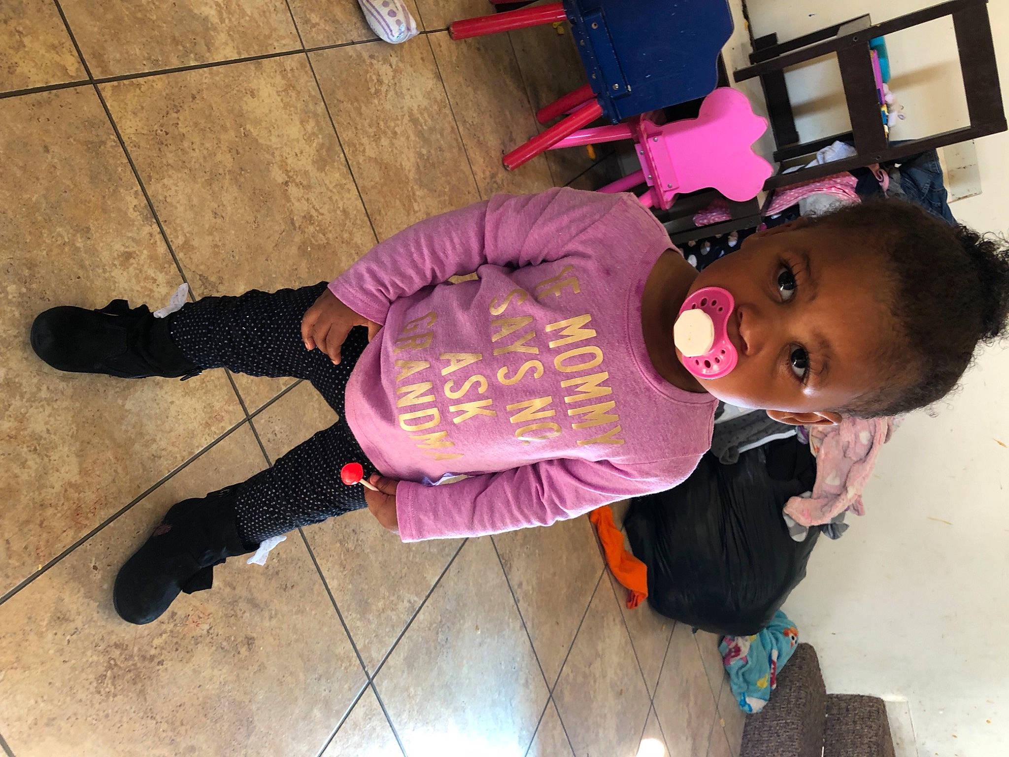 Kalilah joined the competition — help win amazing prizes! baby_toddler_clothing, child, cool, floor, flooring, fun, hardwood, jacket, leg, magenta, outdoor_shoe, person, pink, purple, sandal, shoe, sitting, sneakers, thigh, toddler