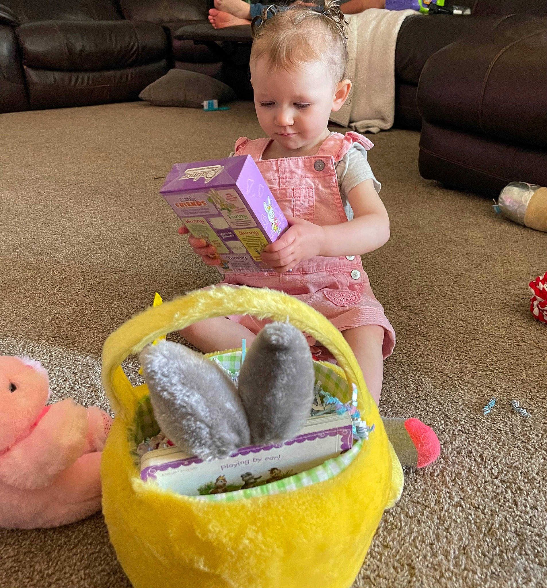 Izabella is registered to the contest to win money with this photo: baby_toddler_clothing, child, comfort, couch, event, flooring, foot, fun, lap, living_room, person, photograph, pink, play, sharing, sitting, sofa_bed, studio_couch, throw_pillow, toddler