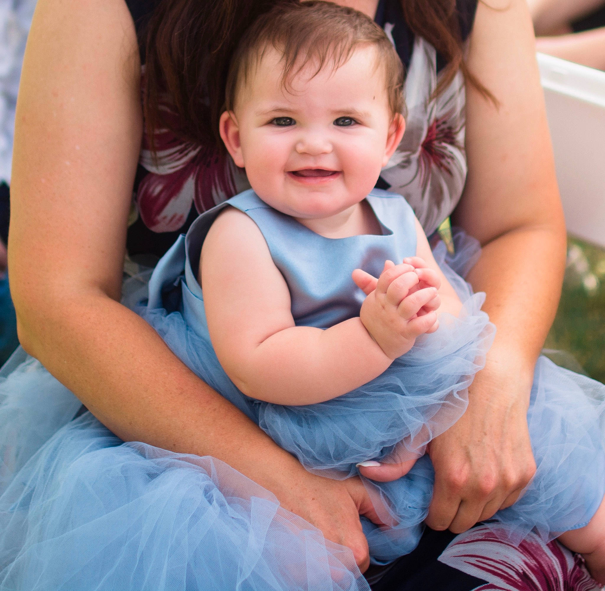 Amelia joined the competition — help win amazing prizes! baby, baby_toddler_clothing, child, electric_blue, event, face, finger, foot, fun, gesture, grass, happy, joy, lap, leisure, person, photograph, sitting, skin, smile