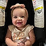 Brynleigh joined the competition — help win amazing prizes! baby, child, smiling, headband, car_seat, infant, cute, happy, holding, clothing, person, young_child, face, sitting, pink, apparel, toy, closeup, indoors, portrait