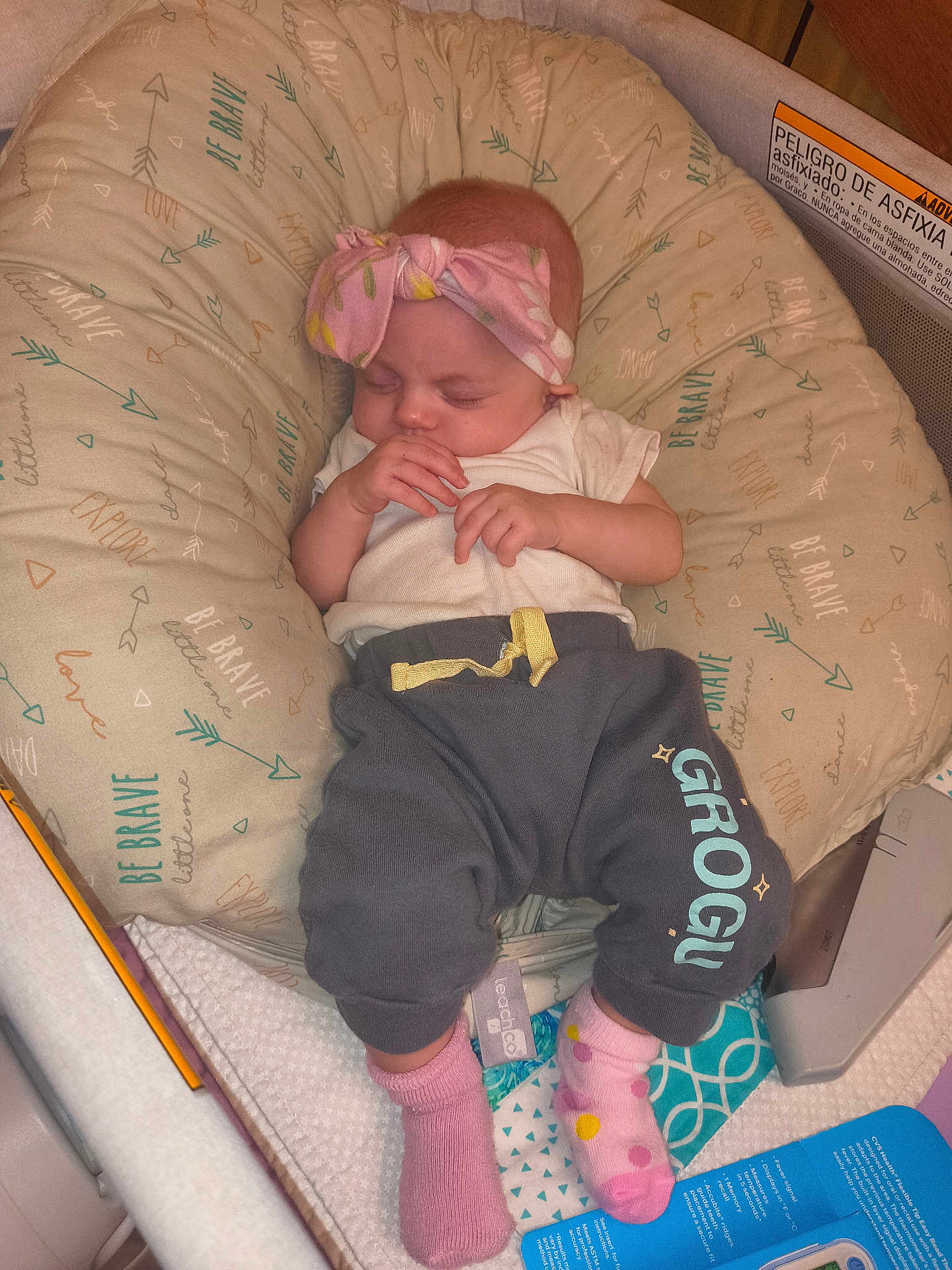 Emersyn joined the competition — help win amazing prizes! baby, sleeping, headband, bow, cushion, baby_seat, clothing, pants, socks, pink, white_shirt, infant, peaceful, indoor, soft_lighting, textile_pattern, cute, resting, child, young