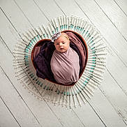 Aria joined the competition — help win amazing prizes! artistic, baby, blanket, circle, cute, headband, heart_shaped_bowl, indoors, infant, medical_theme, newborn, portrait, purple_blanket, small, studio_photo, swaddled, syringes, white_floor, wooden_floor, wrapped