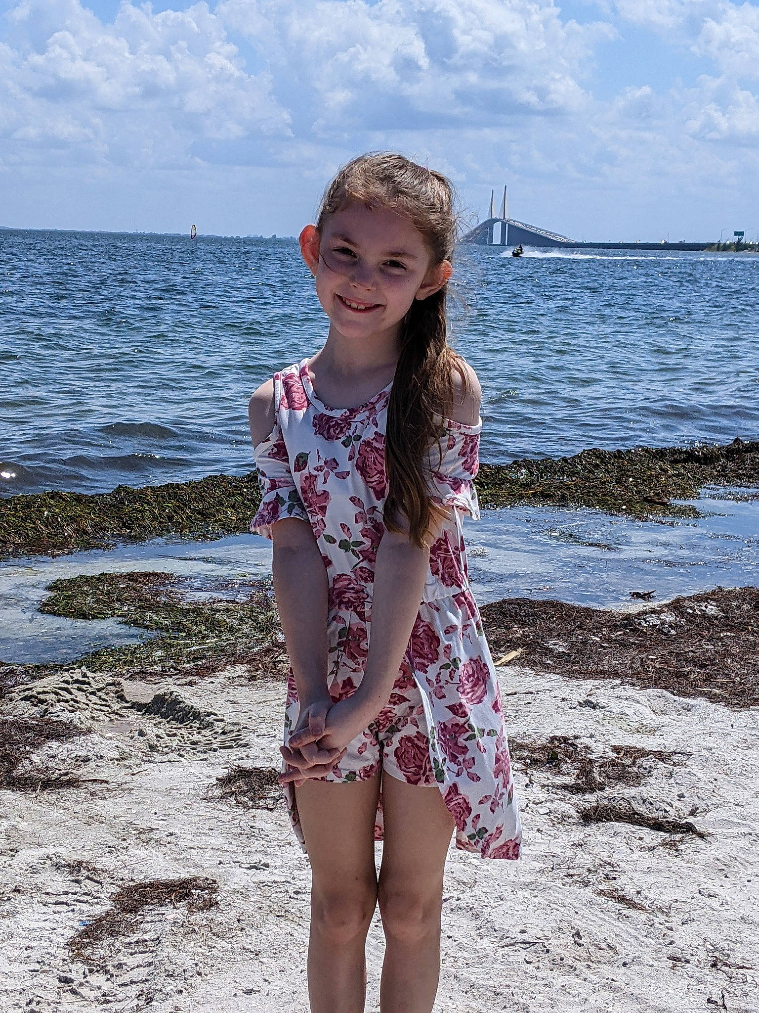 Chloe joined the competition — help win amazing prizes! barefoot, beach, cloud, fun, happy, human_leg, joy, lake, leg, natural_environment, pattern, people_in_nature, people_on_beach, person, sand, sky, sleeve, smile, thigh, toddler
