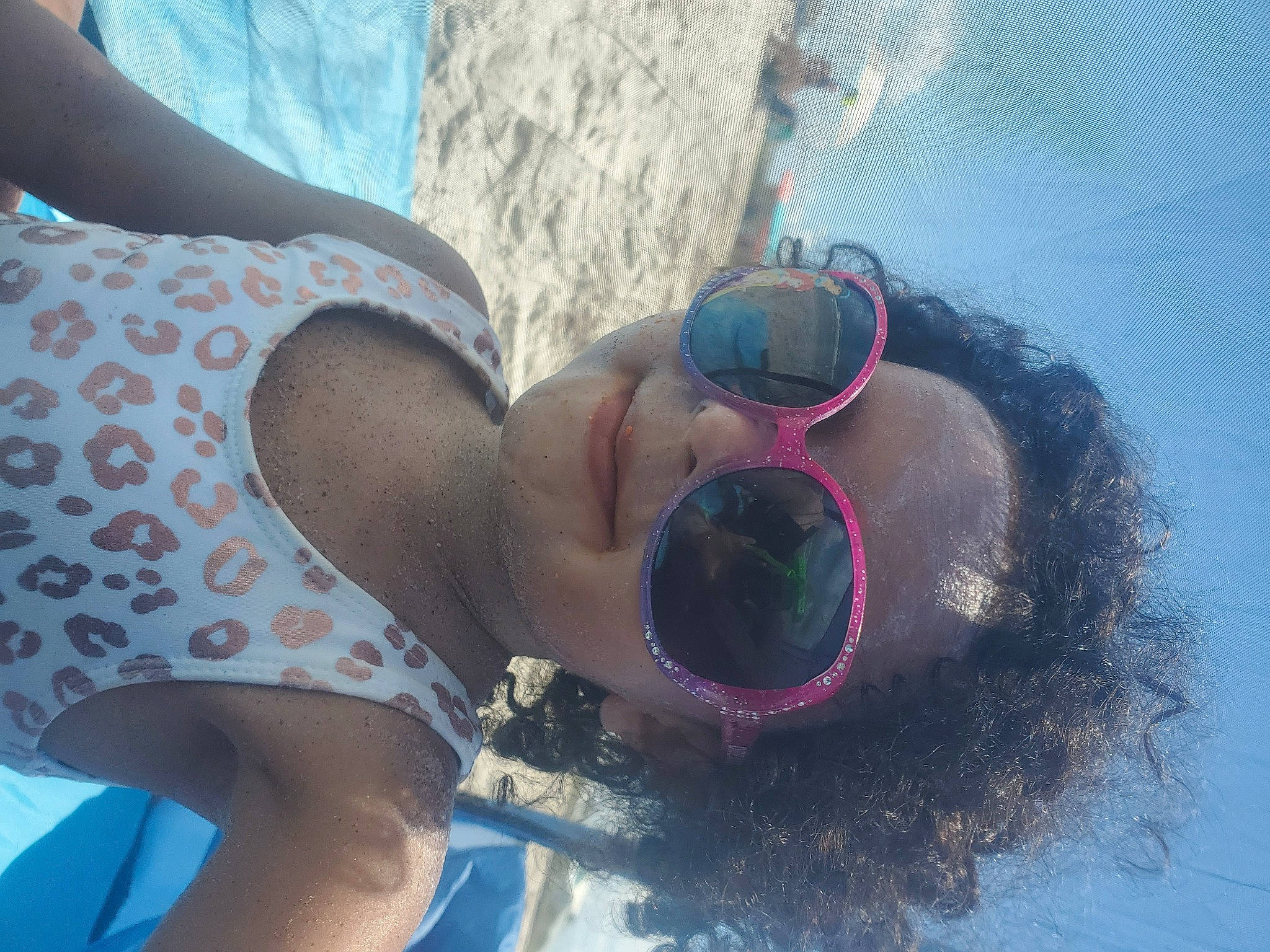 Jasmine is registered to the contest to win money with this photo: beach, body_of_water, brassiere, eyewear, fun, glasses, goggles, happy, hat, human_leg, leisure, people_on_beach, person, personal_protective_equipment, recreation, sunglasses, swimsuit_top, swimwear, thigh, vision_care