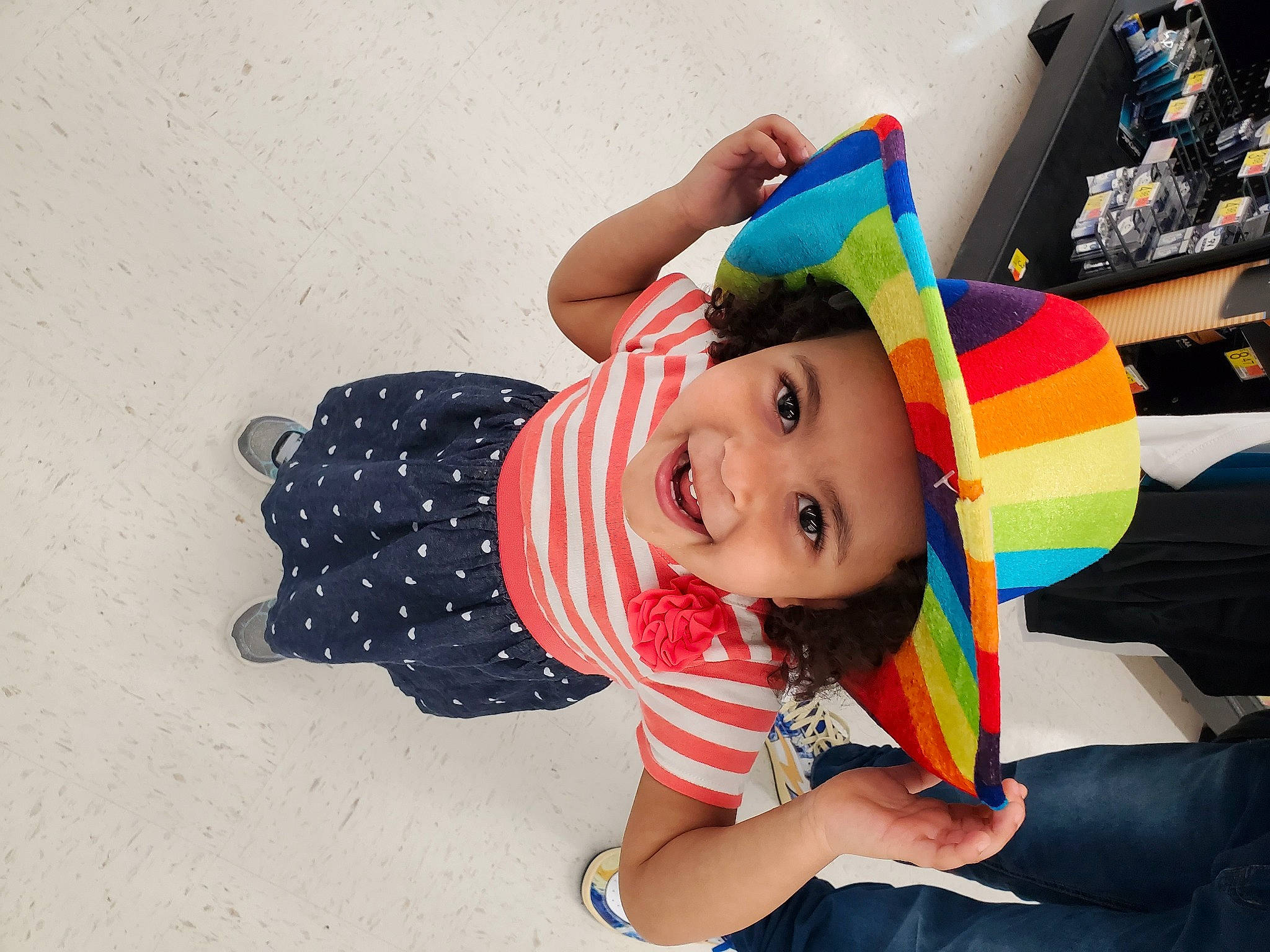 Jasmine is registered to the contest to win money with this photo: baby, baby_toddler_clothing, child, computer_keyboard, costume, fashion_accessory, fun, happy, headgear, headwear, input_device, joy, leisure, magenta, pattern, person, play, room, sitting, smile