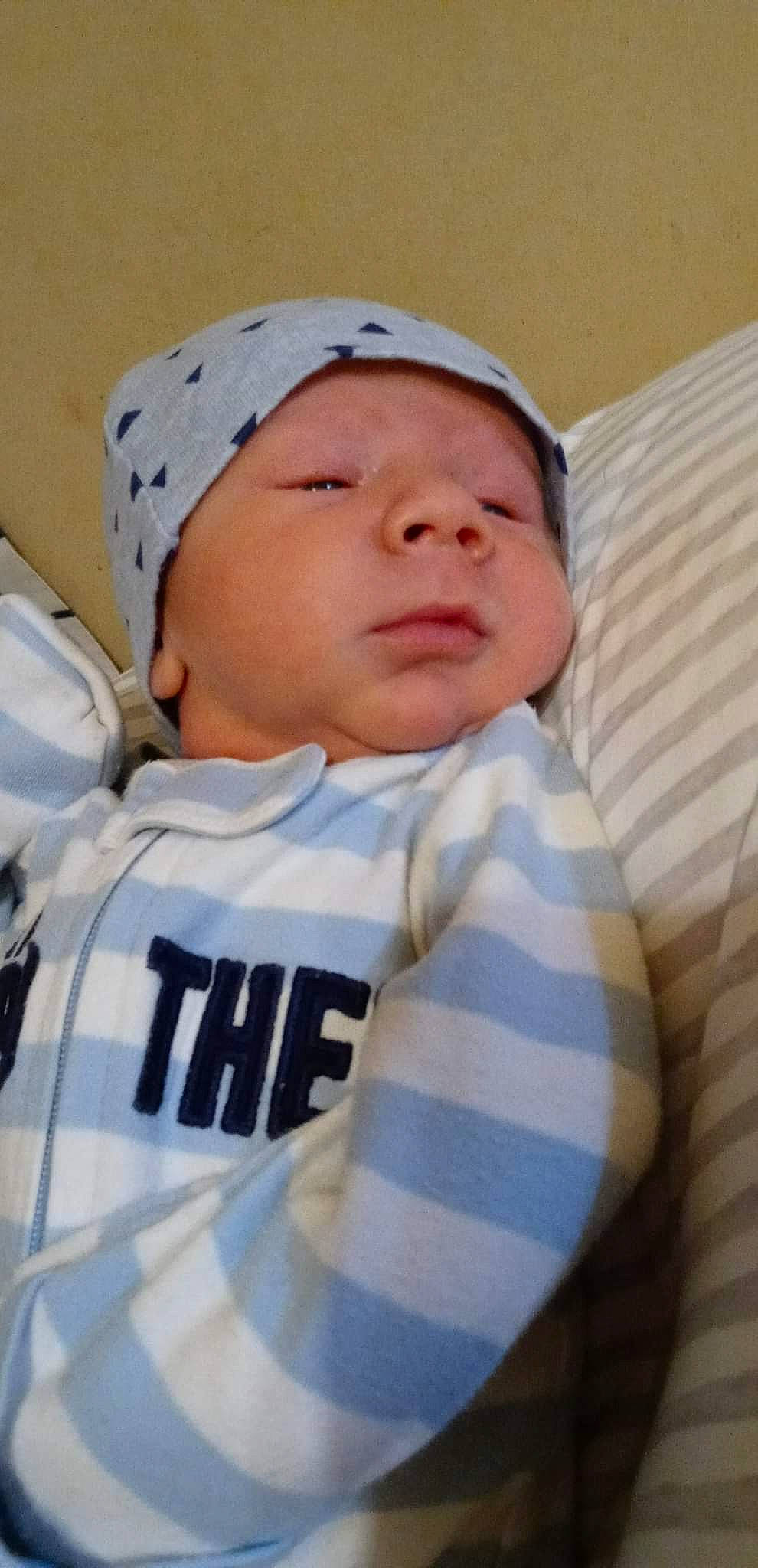 Kyler is registered to the contest to win money with this photo: baby, baby_products, baby_sleeping, baby_toddler_clothing, beanie, cap, cheek, child, comfort, eye, hat, head, linens, nose, person, sitting, skin, sleep, sleeve, t_shirt