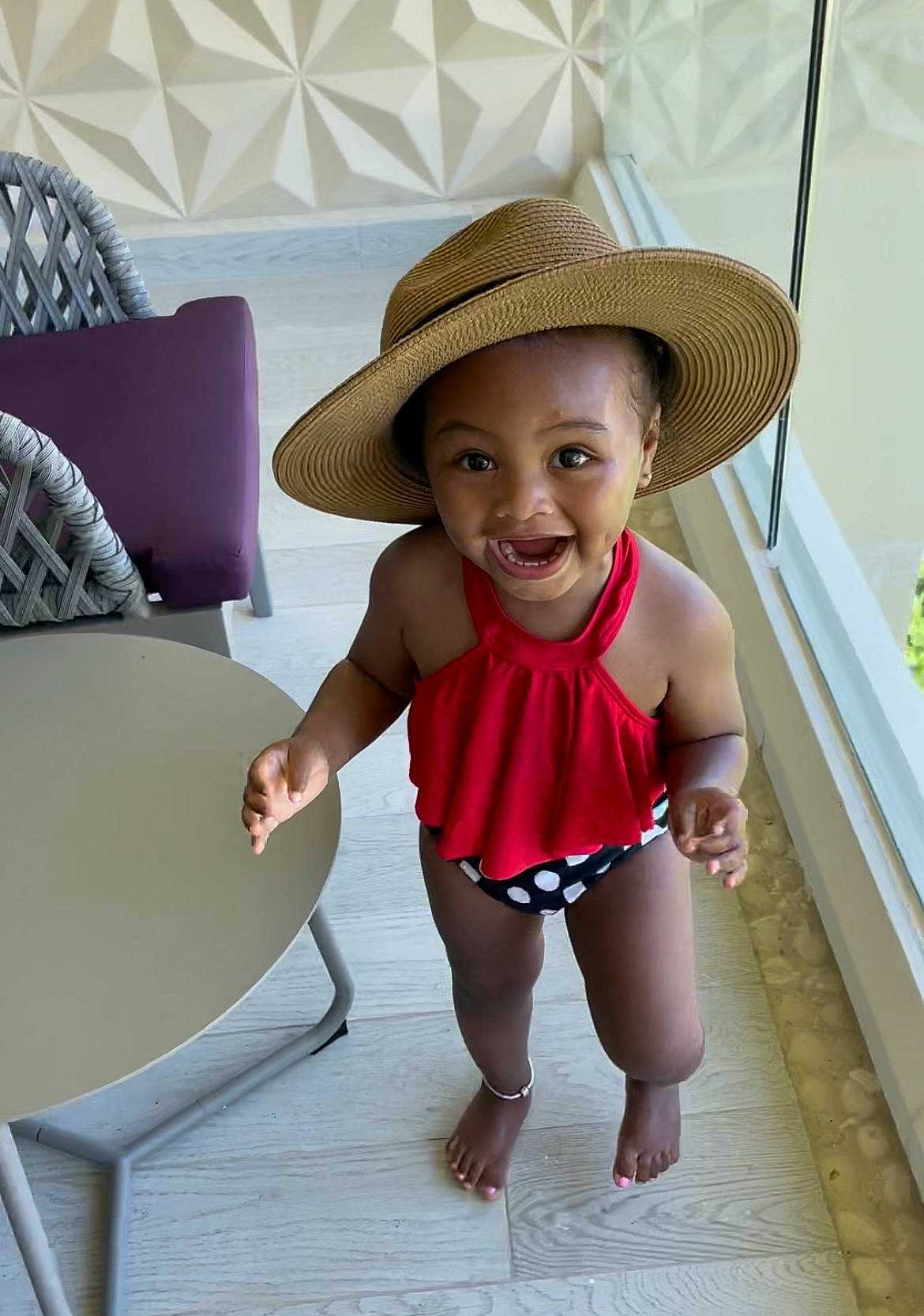Millie joined the competition — help win amazing prizes! baby_toddler_clothing, comfort, floor, flooring, fun, furniture, happy, hat, human_leg, leisure, magenta, person, pink, skin, smile, standing, studio_couch, sun_hat, thigh, toddler