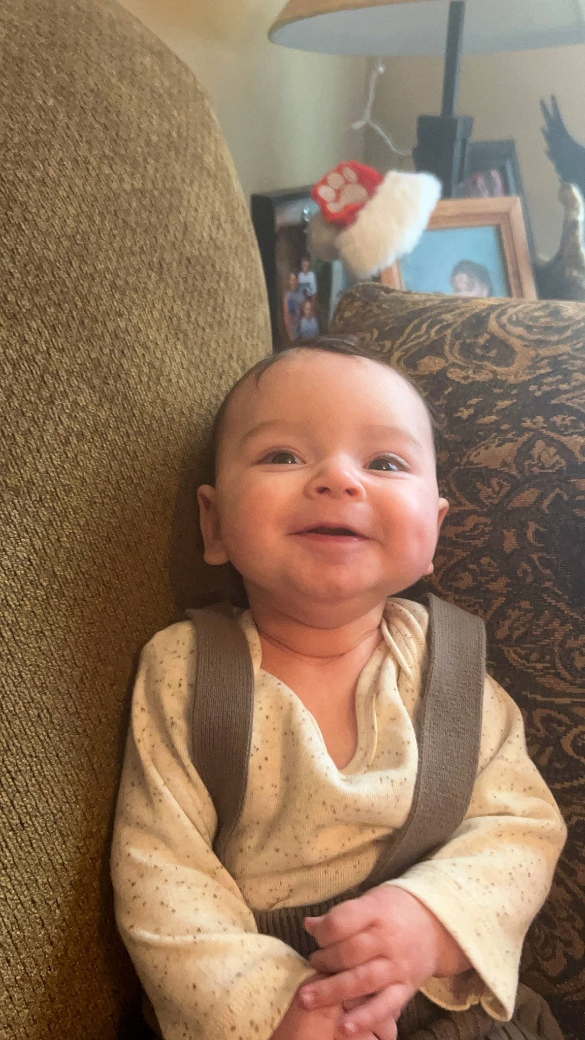 Grayson is registered to the contest to win money with this photo: baby, baby_toddler_clothing, cheek, child, comfort, eye, flooring, fun, hairstyle, hand, happy, head, iris, joy, lip, nose, person, room, sitting, smile