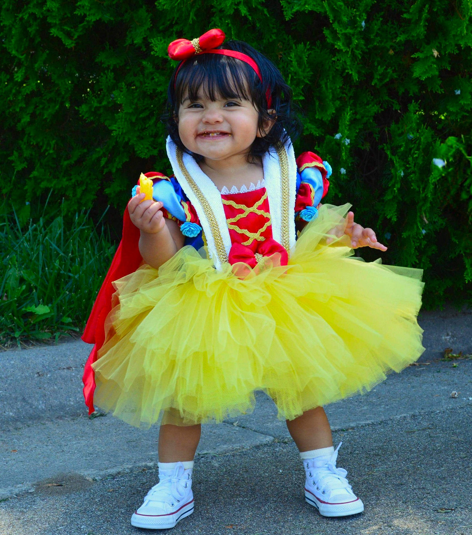 Jaylani is registered to the contest to win money with this photo: bangs, child, costume, costume_hat, electric_blue, event, eye, face, fashion_accessory, fictional_character, fun, grass, happy, headgear, hime_cut, joy, magenta, mythical_creature, person, plant