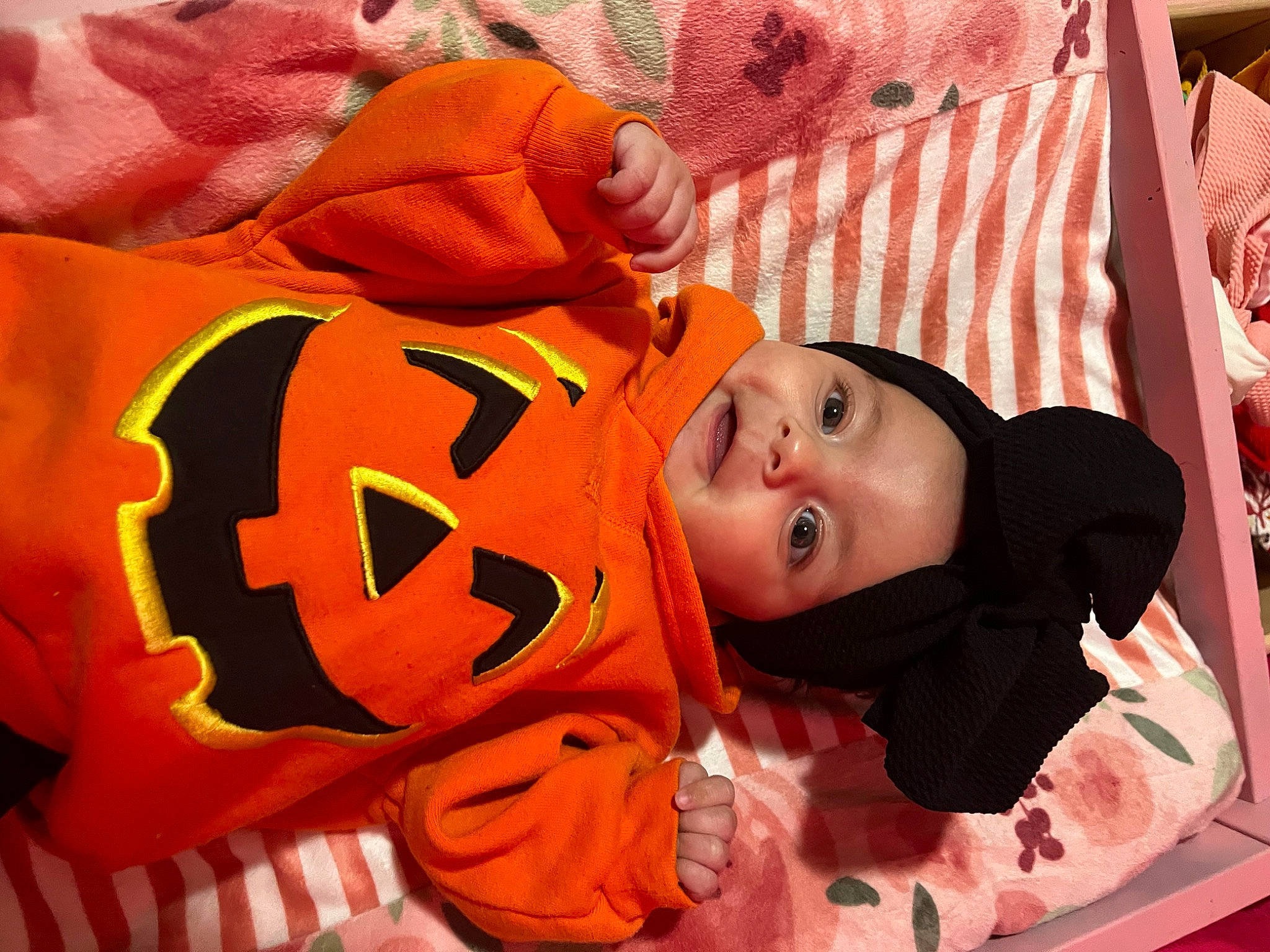 Ariyanna is registered to the contest to win money with this photo: baby, baby_products, baby_toddler_clothing, baby_toys, carmine, child, comfort, fun, happy, headwear, linens, mammal, orange, person, room, sleeve, smile, toddler