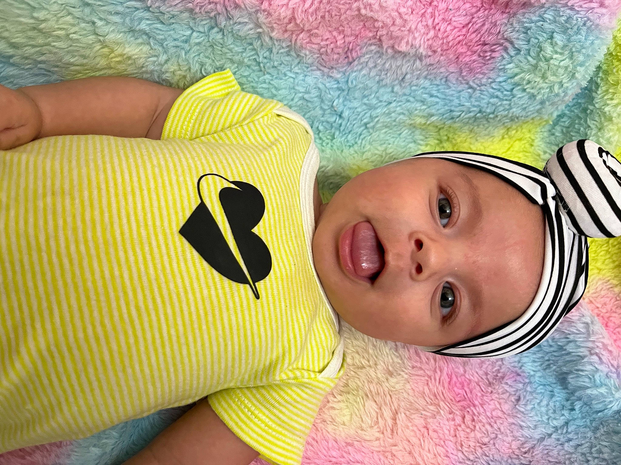 Ariyanna is registered to the contest to win money with this photo: baby, baby_toddler_clothing, cheek, child, comfort, eye, eyelash, facial_expression, finger, gesture, happy, head, headgear, headwear, iris, nose, person, pink, skin, smile