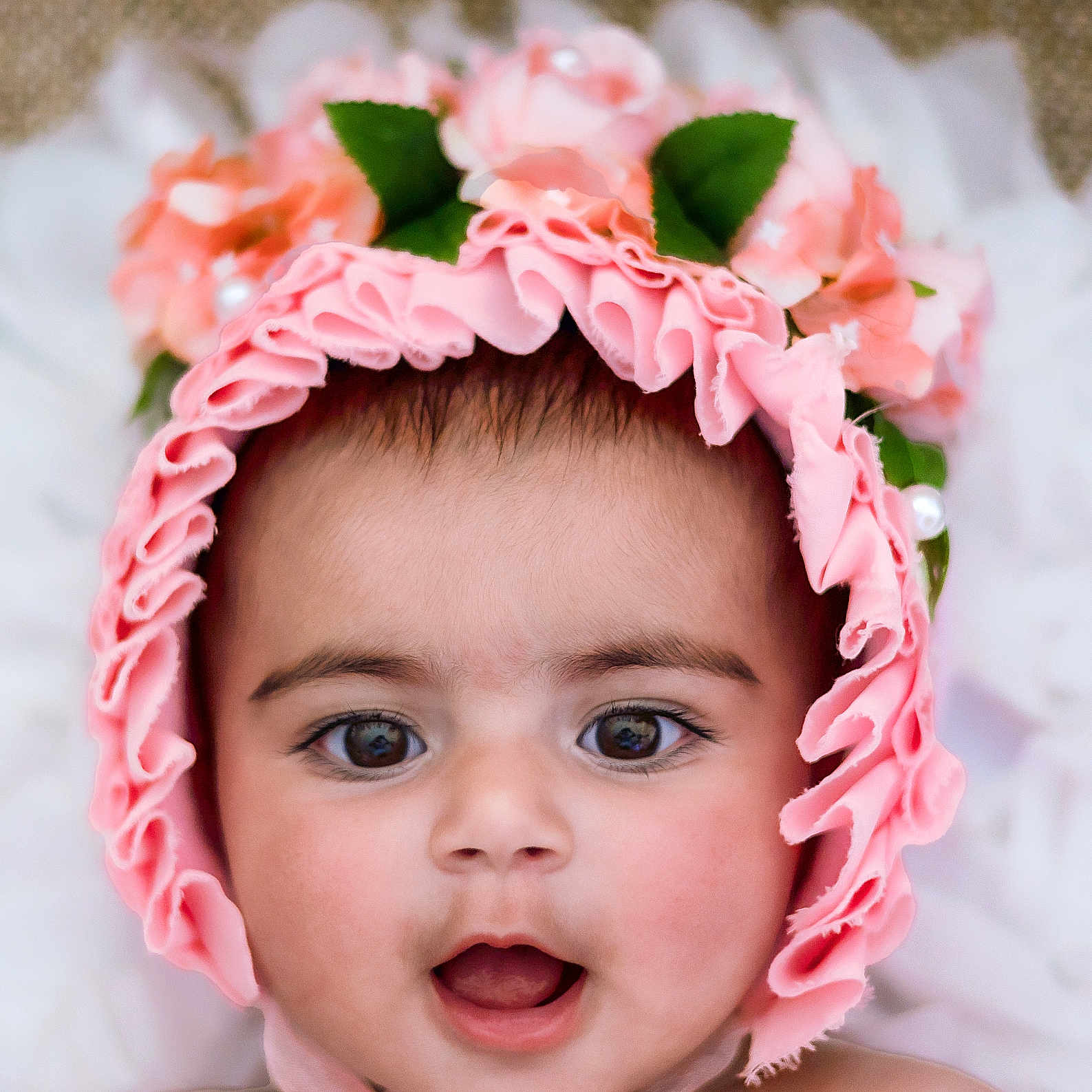 Rubab Kaur is registered to the contest to win money with this photo: adorable, baby, bonnet, child, closeup, cute, expression, eyes, face, flowers, headwear, infant, innocent, mouth, person, pink, portrait, skin, soft, young