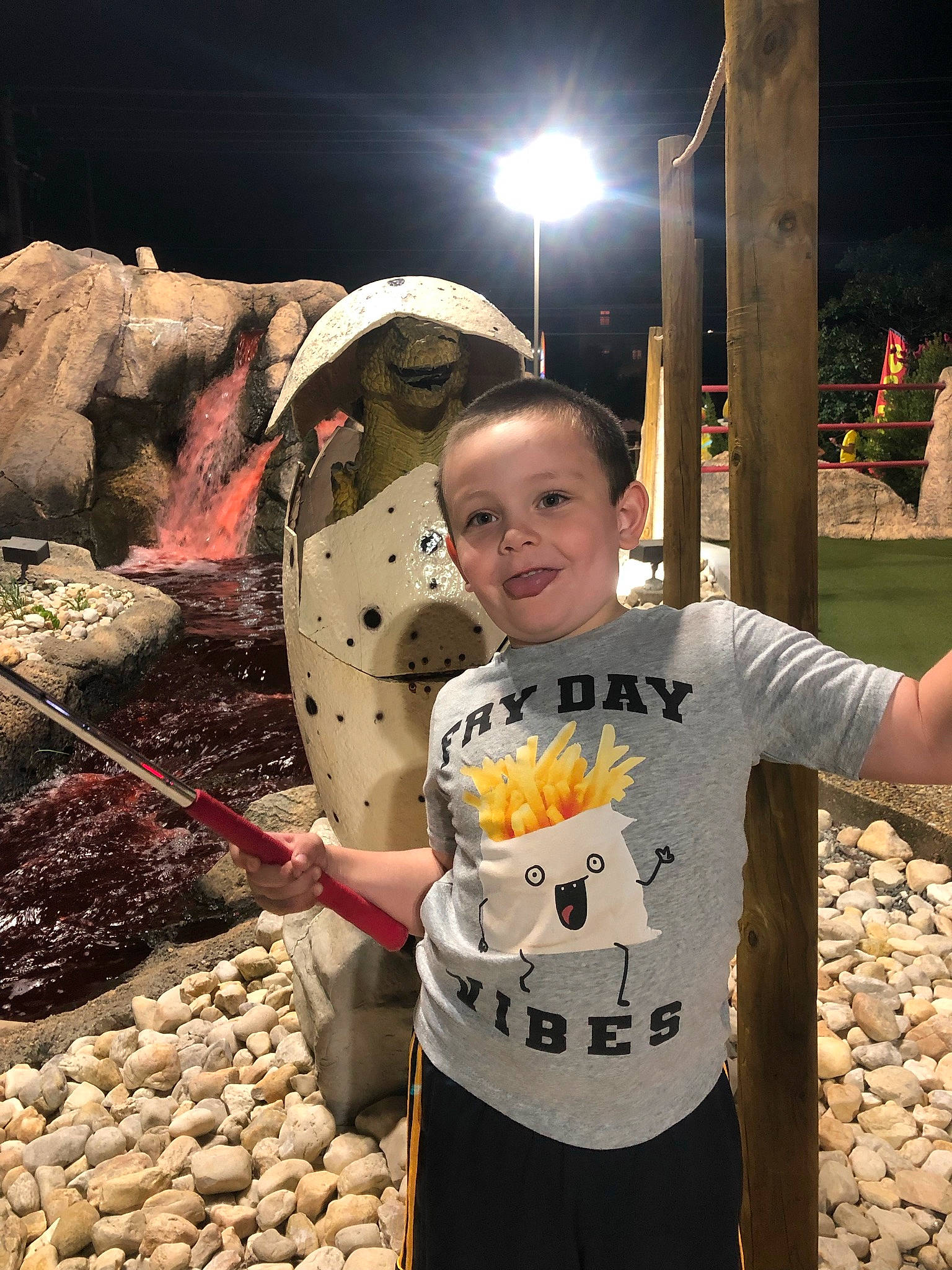 Jaxson is registered to the contest to win money with this photo: bedrock, child, flash_photography, fun, happy, joy, leisure, person, recreation, rock, sleeve, smile, soil, street_light, t_shirt, toddler, top, tourism, travel, vacation