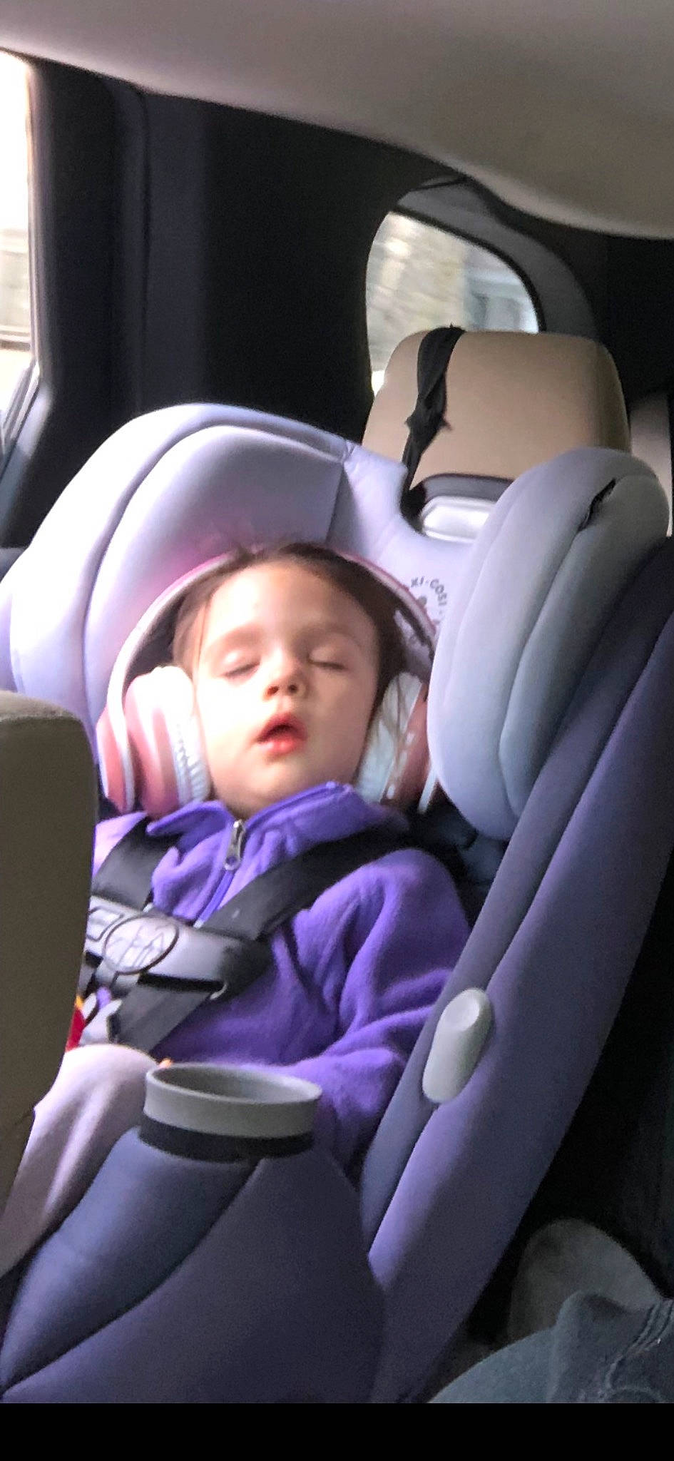Sabrina is registered to the contest to win money with this photo: auto_part, automotive_design, baby, baby_carriage, baby_in_car_seat, car_seat, car_seat_cover, comfort, fun, head_restraint, mode_of_transport, motor_vehicle, passenger, person, purple, seat_belt, steering_part, steering_wheel, toddler, vehicle