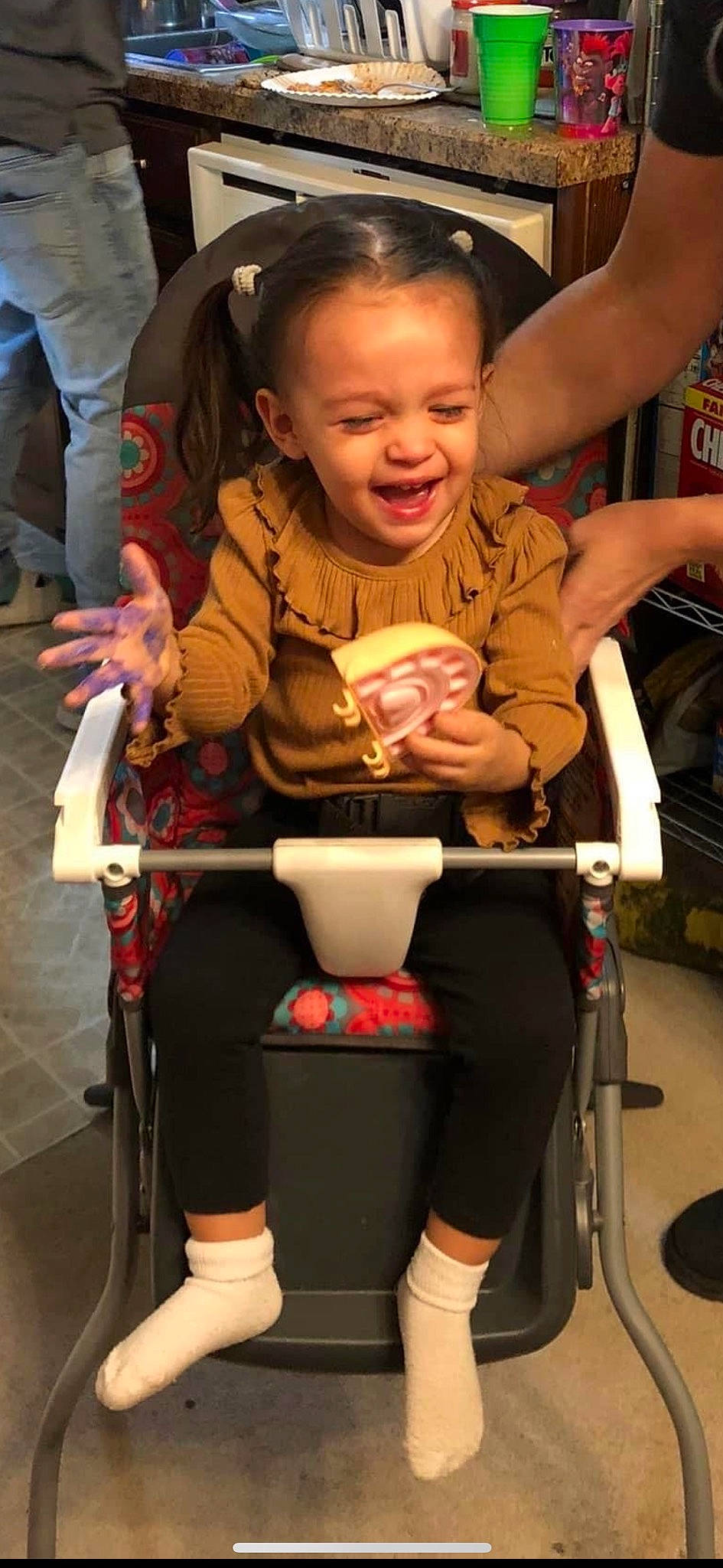 Sabrina is registered to the contest to win money with this photo: baby_carriage, baby_products, chair, child, event, food, fun, happy, human_leg, leg, people, person, photograph, recreation, sitting, skin, smile, snapshot, thigh, tire