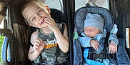 Lucas joined the competition — help win amazing prizes! child, baby, stroller, smiling, sleeping, hat, onesie, tank_top, seatbelt, baby_carrier, cute, siblings, outdoor, sunlight, happy, infant, toddler, people, portrait, resting