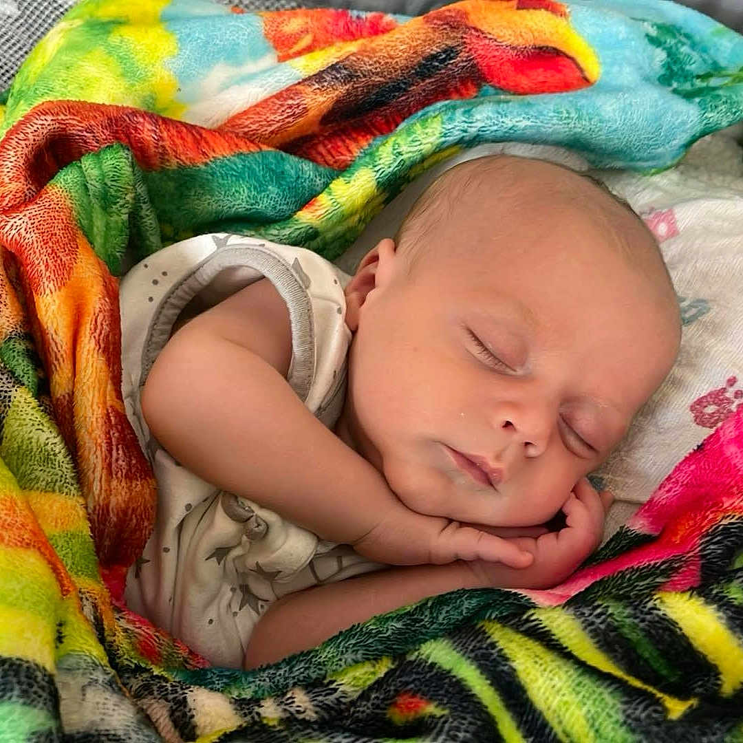 Lucas joined the competition — help win amazing prizes! baby, blanket, child, closeup, colorful, comfort, cozy, cute, face, hands, infant, nap, peaceful, portrait, rest, sleeping, soft, toddler, warm, wrapped
