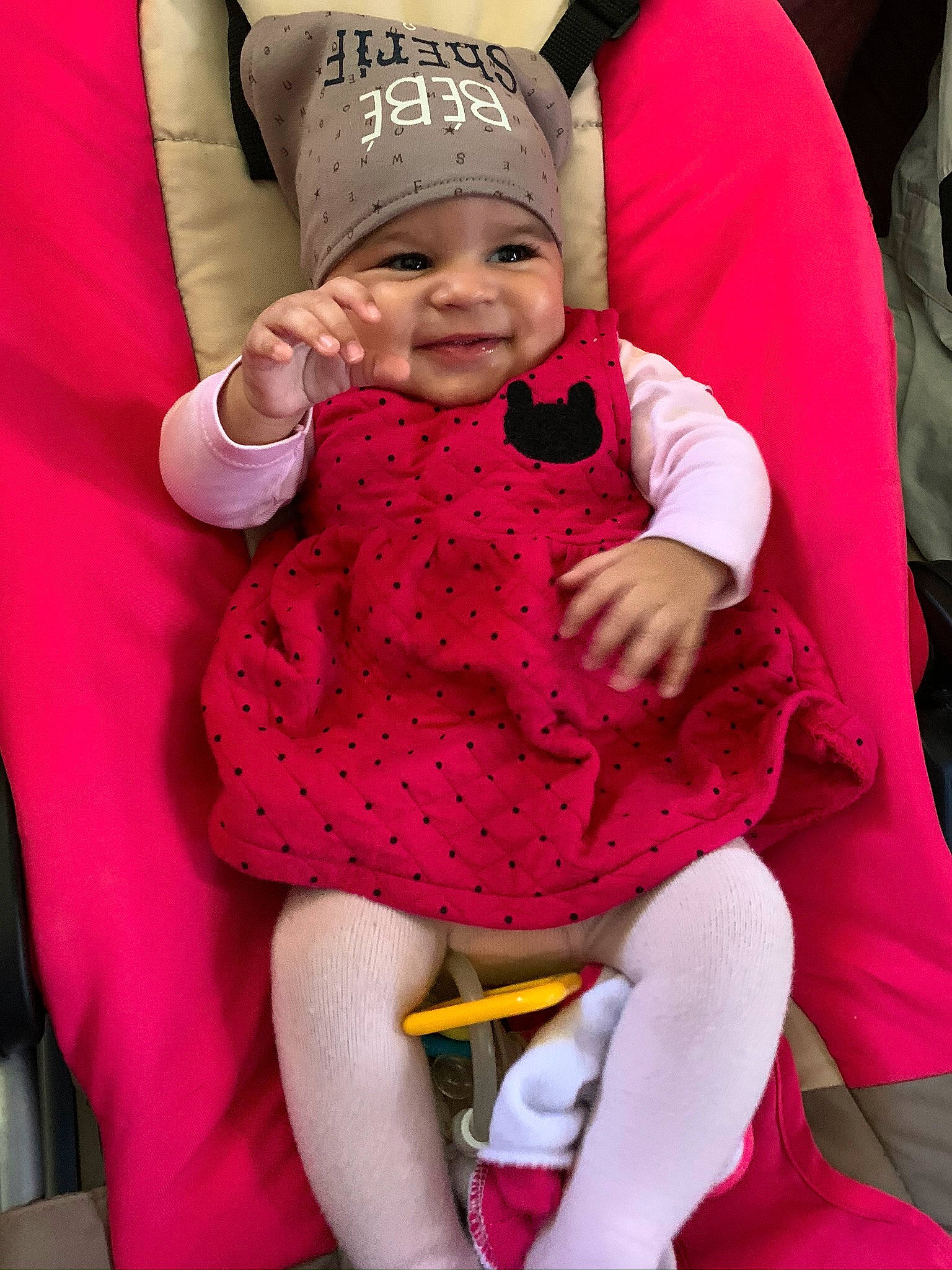 Liyah participe au concours pour gagner de l'argent avec cette photo : baby, baby_carriage, baby_products, car_seat, child, headwear, joy, magenta, person, pink, product, red, skin, smile, toddler