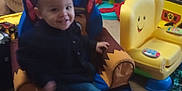 Cameron joined the competition — help win amazing prizes! child, toddler, smile, indoor, toy, chair, playroom, colorful, furniture, carpet, casual_clothing, happy, young_child, living_room, plastic_toy, footwear_off, decor, small_table, remote_control, stuffed_toy