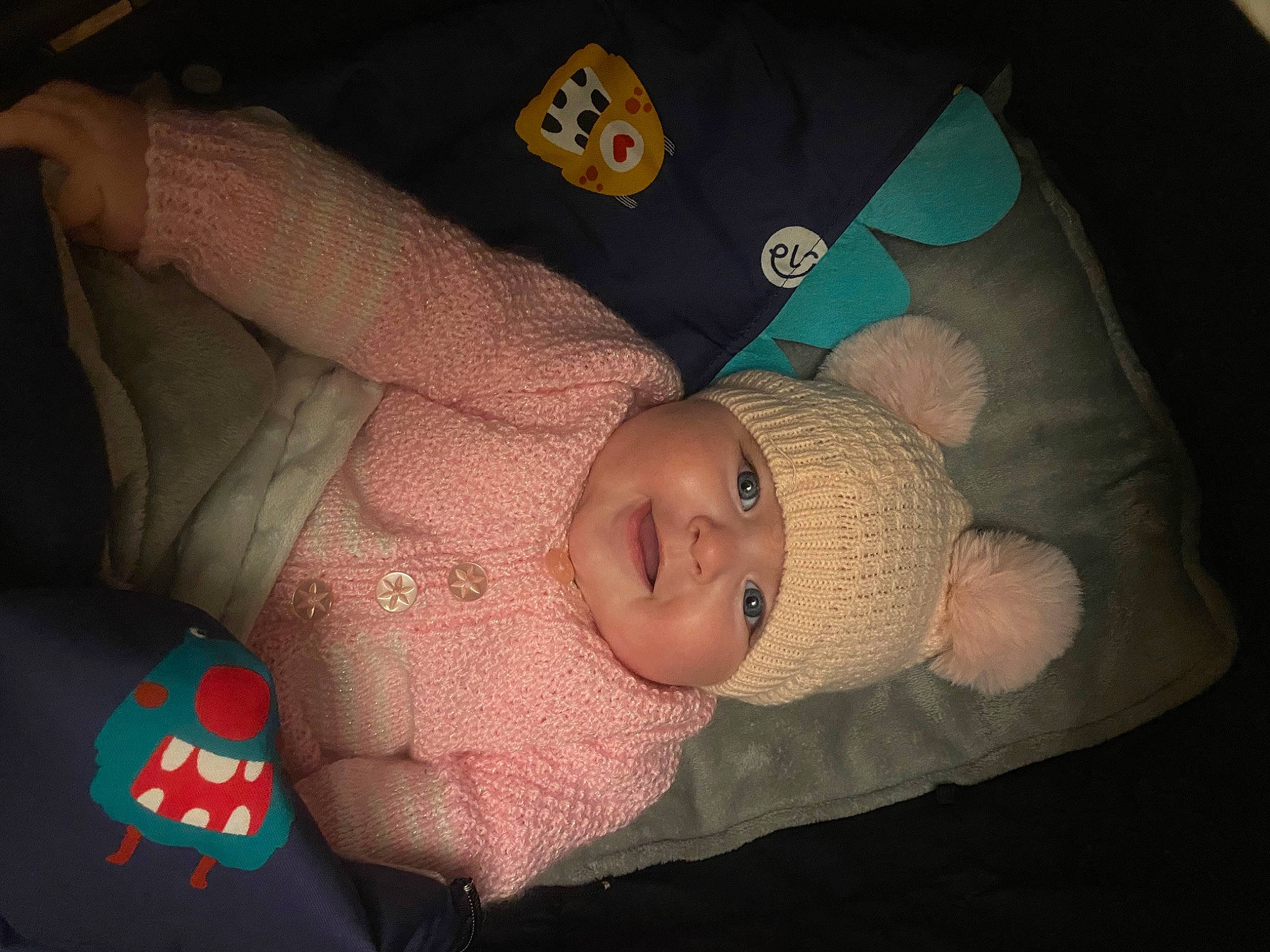 Lydia is registered to the contest to win money with this photo: arm, baby, baby_products, baby_toddler_clothing, bedtime, carmine, cheek, child, comfort, eye, finger, hand, head, headwear, human_body, joy, linens, mouth, nose, person
