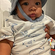 Davinchi joined the competition — help win amazing prizes! baby, blinds, blue_hat, child, chubby_cheeks, clothing, couch, curious_expression, hand, hat, holding, indoor, infant, patterned_shirt, person, sea_creatures, short_sleeves, soft_lighting, white_shirt, wide_eyes