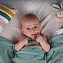 Eden is registered to the contest to win money with this photo: baby, bed, blanket, bodypart, couch, crib, cushion, face, finger, furniture, hand, head, homedecor, infantbed, linen, newborn, person, photography, portrait, toy