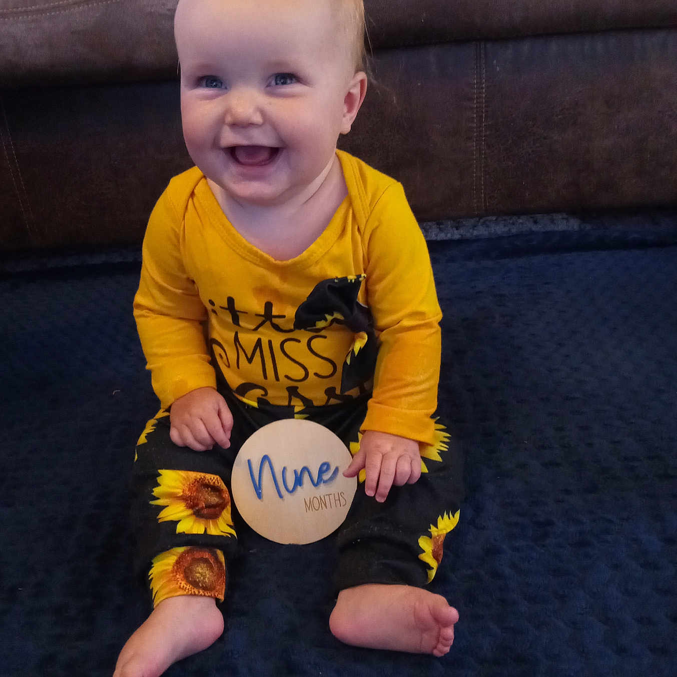 Nina joined the competition — help win amazing prizes! architecture, baby, babylaughing, bodypart, clothing, couch, cushion, face, finger, furniture, hand, happy, head, homedecor, pants, person, photography, portrait, sitting, t_shirt