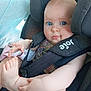 baby, blue_eyes, car_interior, car_seat, child, child_safety, closeup, clothing, cute, foot, hand, holding_foot, indoor, infant, person, portrait, pout, seatbelt, soft_skin, straps