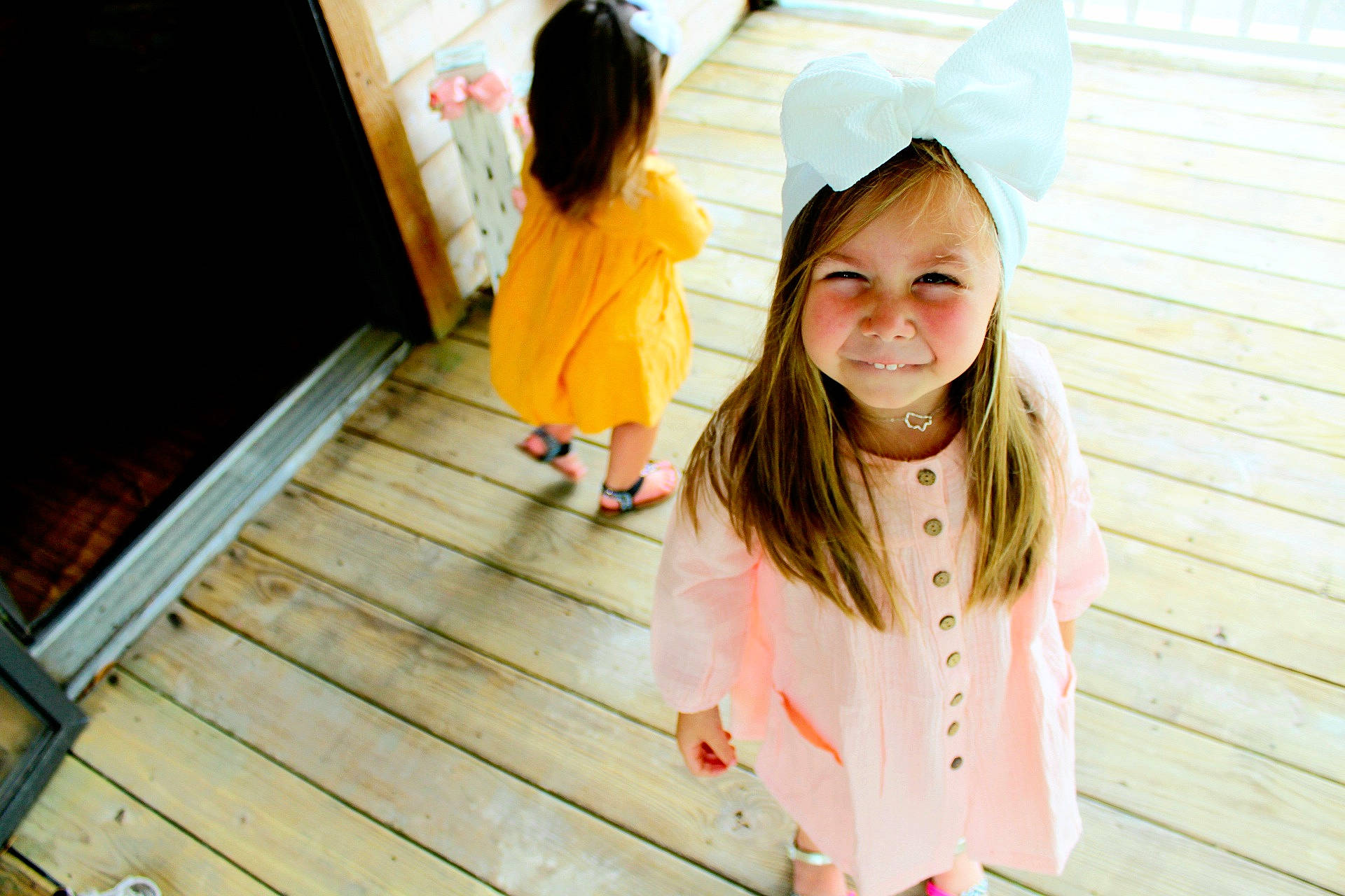 Natalie is registered to the contest to win money with this photo: child, child_model, happy, joy, long_hair, person, photograph, photography, skin, smile, snapshot, toddler, wood, yellow