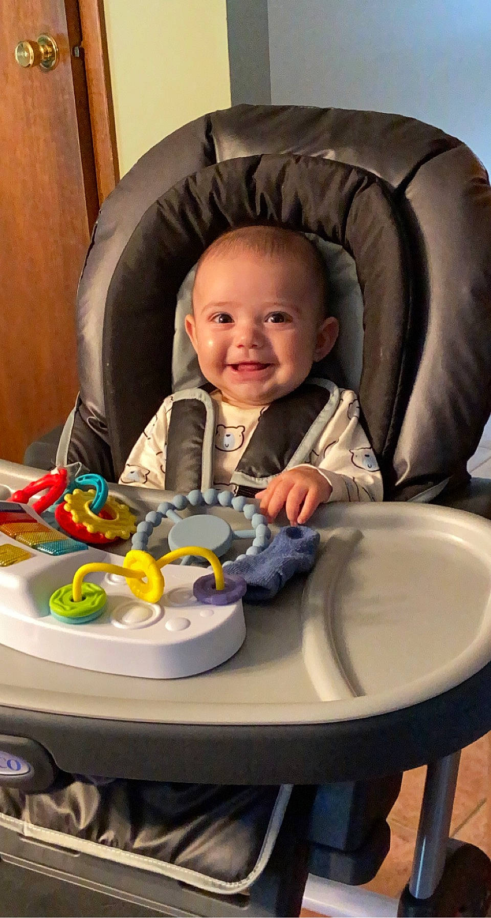 Benicio is registered to the contest to win money with this photo: baby, chair, cheek, child, comfort, eye, face, facial_expression, fun, hairstyle, head, iris, joy, people, person, product, skin, smile, table, toddler