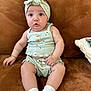 baby, infant, child, couch, brown, clothing, headband, socks, sitting, cute, expression, indoors, portrait, young, skin, face, hand, legs, button, fabric
