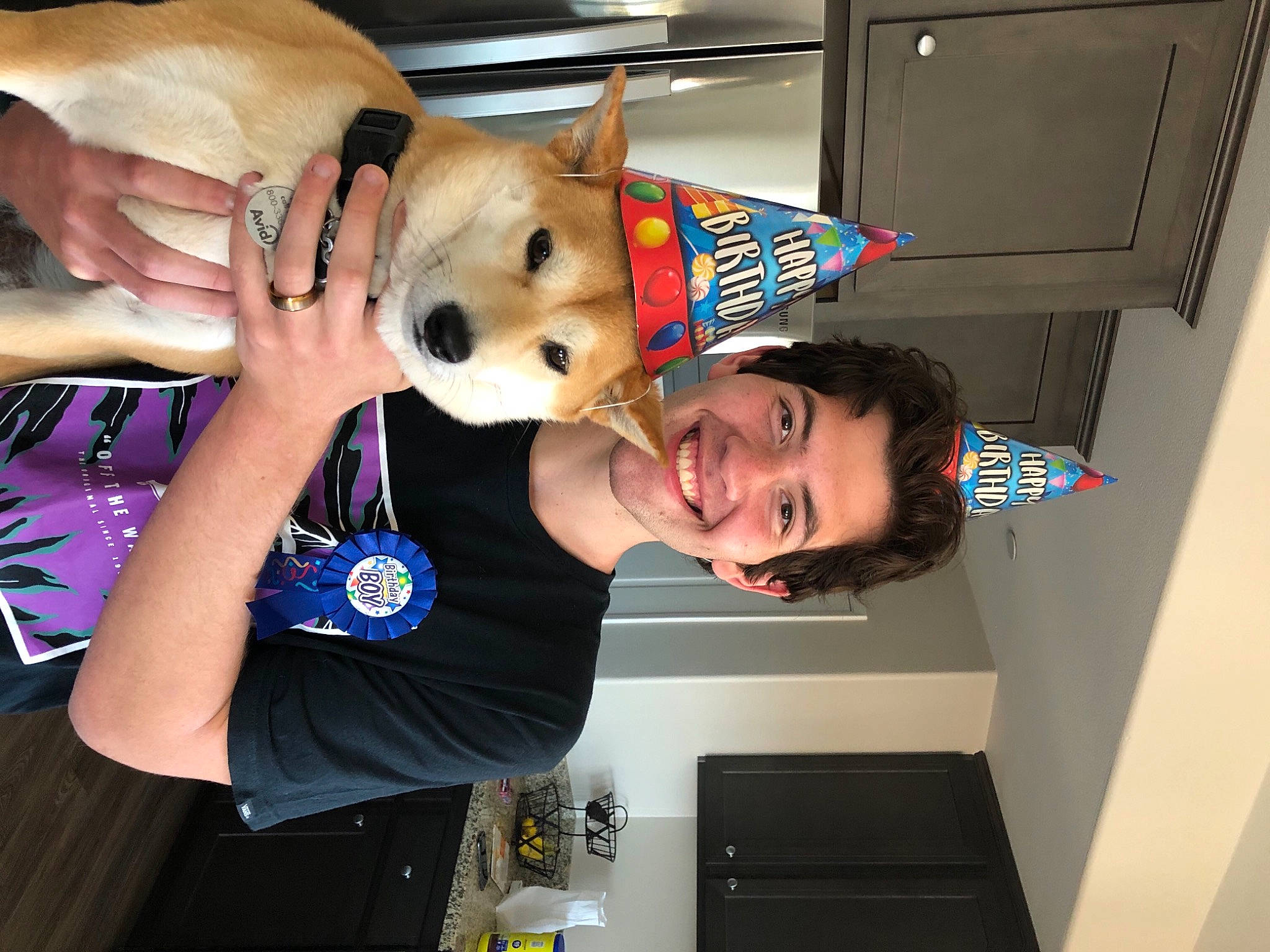 Luna is registered to the contest to win money with this photo: child, companion_dog, dog, ear, fawn, fun, fur, gesture, organ, room, smile, t_shirt, toy, train, vacation