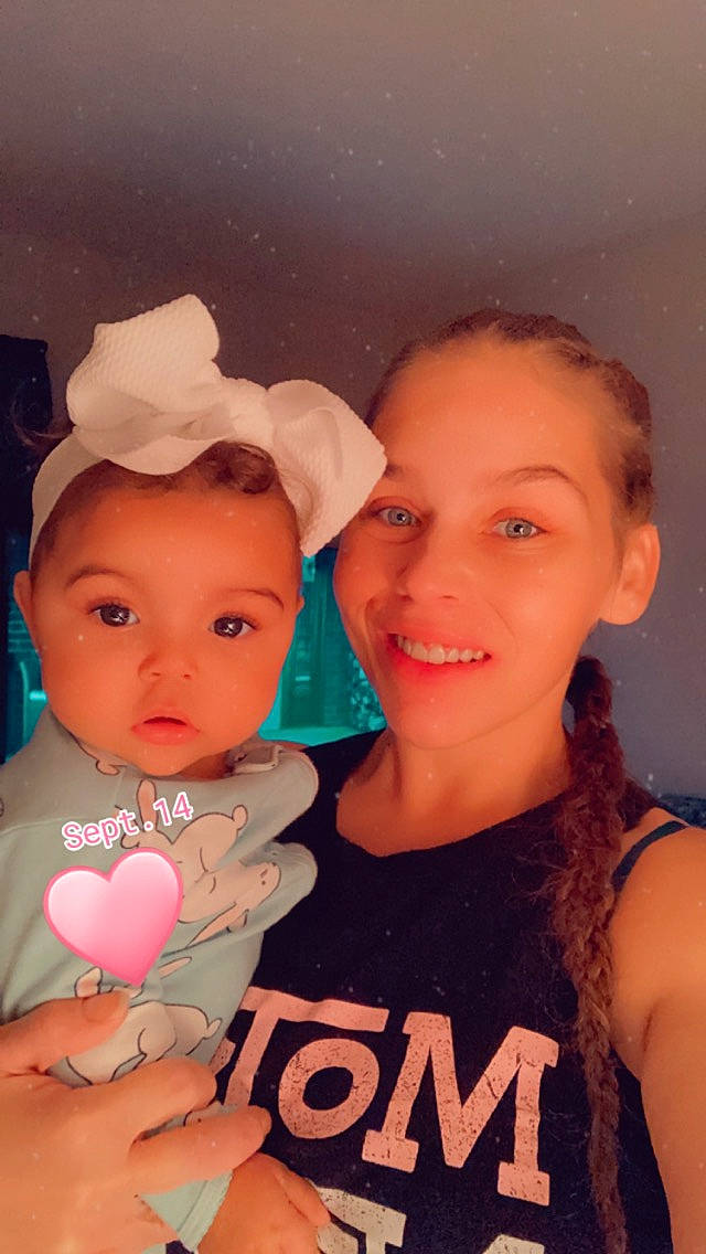 Julianne is registered to the contest to win money with this photo: baby, baby_toddler_clothing, cap, cheek, child, chin, event, facial_expression, fun, gesture, happy, joy, lip, mouth, muscle, organ, person, pink, skin, smile