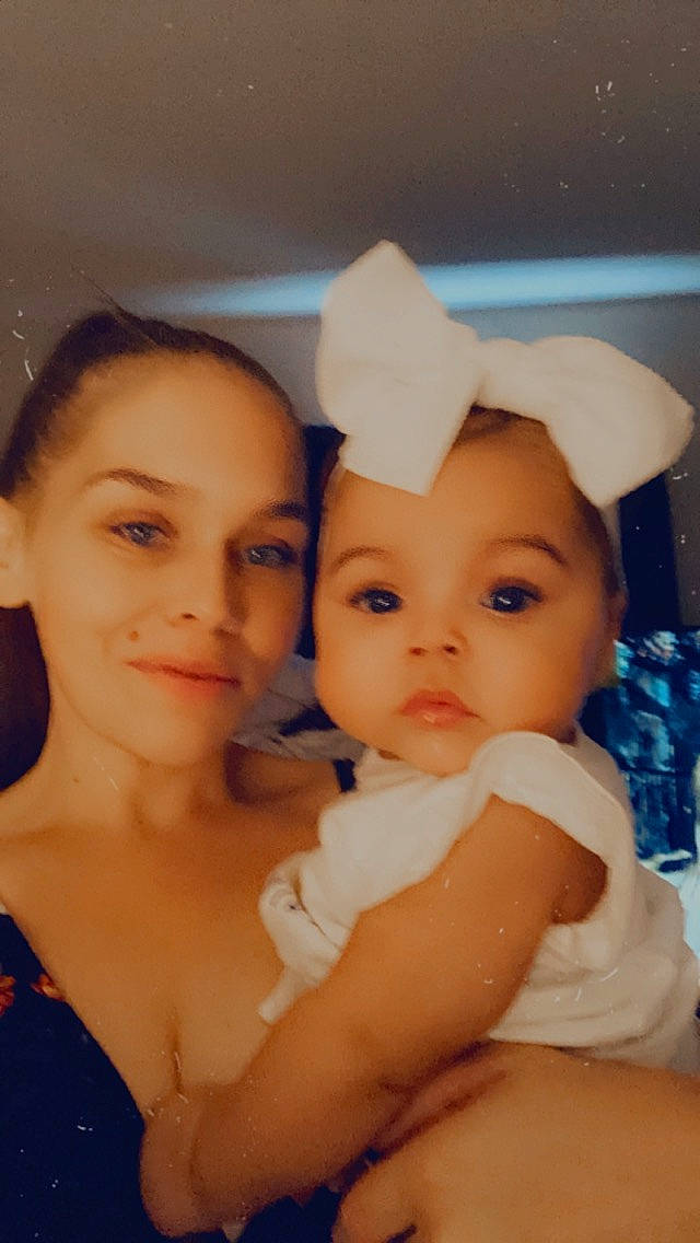 Julianne is registered to the contest to win money with this photo: abdomen, baby, cap, cheek, child, event, fashion_accessory, fun, gesture, hair_accessory, happy, headgear, headpiece, hug, iris, jewellery, joy, love, person, sitting