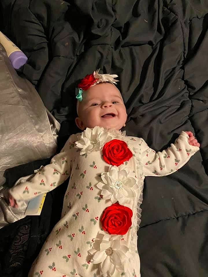 Paisley joined the competition — help win amazing prizes! baby, baby_toddler_clothing, child, event, eye, fashion_design, flower, flower_arranging, happy, hat, headpiece, iris, outerwear, person, petal, pink, plant, smile, sunglasses, toddler