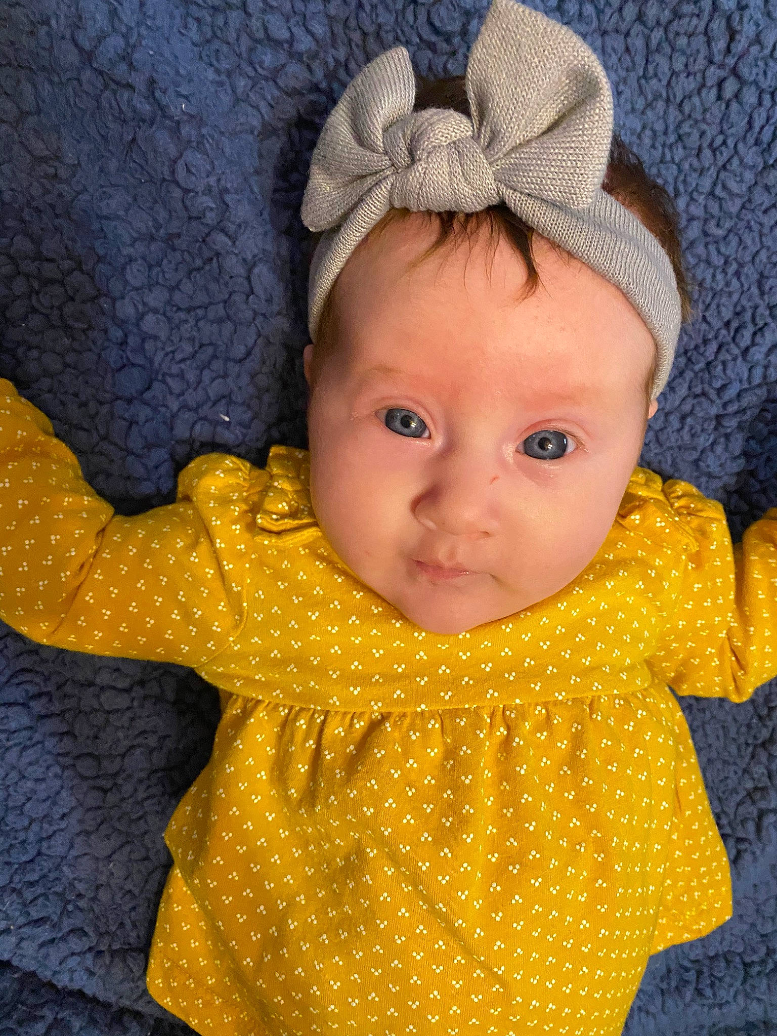 Kennedi is registered to the contest to win money with this photo: baby, baby_toddler_clothing, cheek, child, design, ear, eye, face, head, headgear, knitting, outerwear, pattern, person, skin, sleeve, toddler, yellow