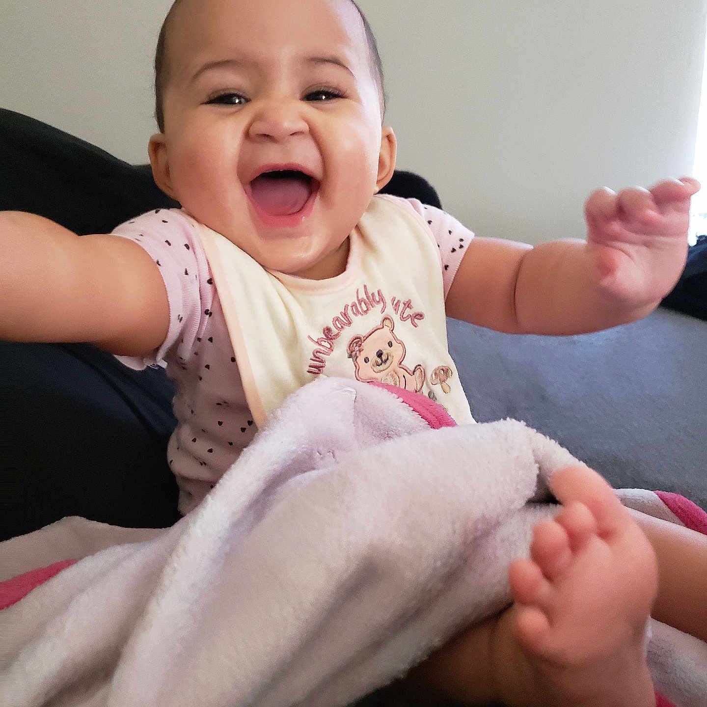 Jaleena is registered to the contest to win money with this photo: baby, babylaughing, bodypart, face, finger, hand, happy, head, laughing, newborn, person, photography, portrait, smile, towel, wrist