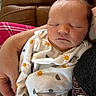 Jackson is registered to the contest to win money with this photo: baby, caregiver, closed_eyes, closeup, clothing, couch, cozy, face, indoors, infant, leather, moon_pattern, newborn, onesie, patterned_fabric, peaceful, portrait, resting, sleeping, sun_pattern