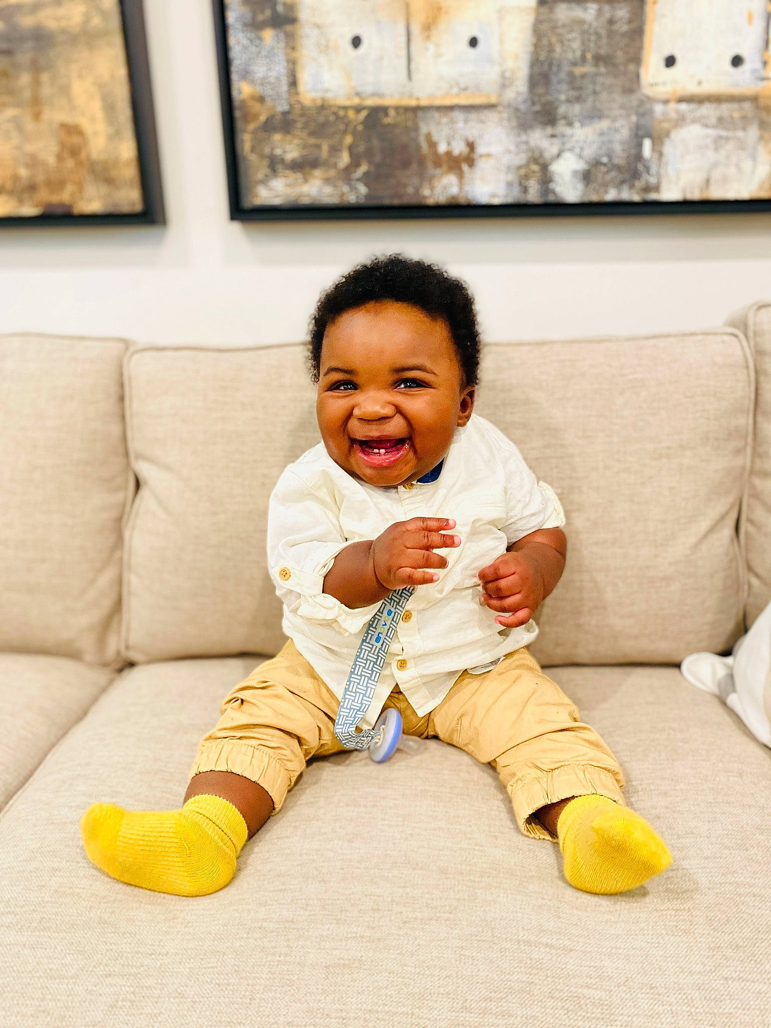 Adriel joined the competition — help win amazing prizes! art, baby, baby_toddler_clothing, child, comfort, couch, eye, facial_expression, flash_photography, floor, flooring, happy, living_room, person, picture_frame, room, sitting, sleeve, smile, toddler