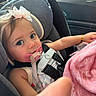 Araceli is registered to the contest to win money with this photo: baby, blanket, bracelet, car_interior, car_seat, child, closeup, clothing, cute, daylight, infant, pacifier, person, pink_bow, portrait, safety_harness, seatbelt, toddler, window, young_child