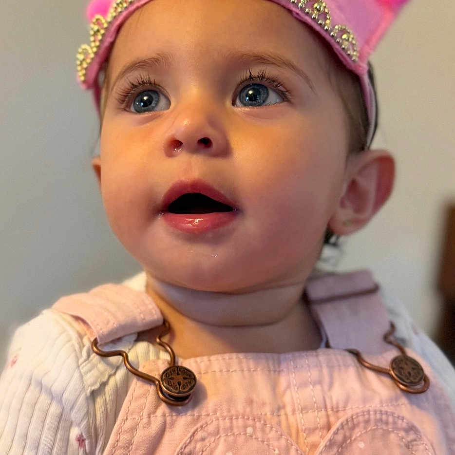 Araceli joined the competition — help win amazing prizes! baby, birthday_crown, celebration, child, clothing, cute, expression, eyes, face, happy_birthday, headwear, heart_patch, indoors, overalls, person, pink, portrait, skin, toddler, young_child