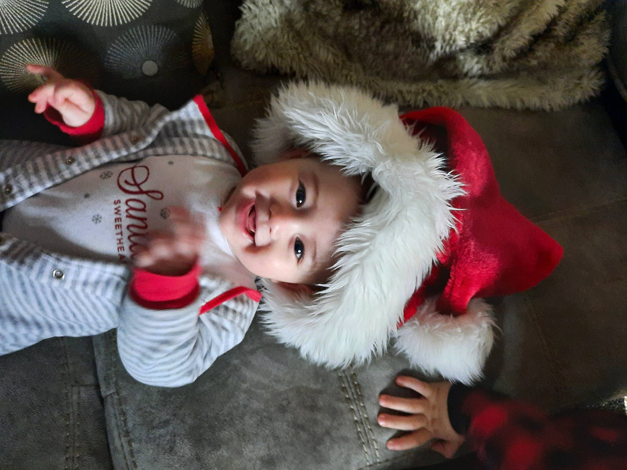 Malia joined the competition — help win amazing prizes! carmine, child, christmas, christmas_eve, costume, event, flesh, fun, fur, fur_clothing, glove, hand, happy, headwear, holiday, joy, lap, person, santa_claus, smile
