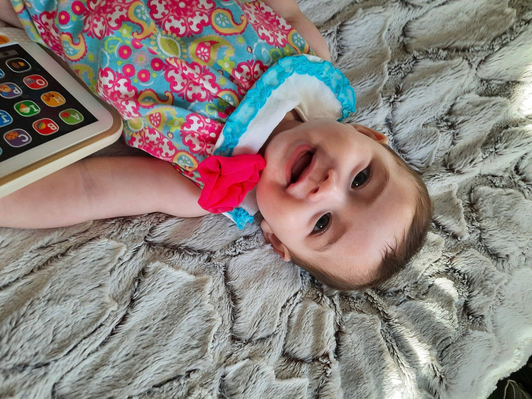 Malia joined the competition — help win amazing prizes! baby_toddler_clothing, child, communication_device, eye, facial_expression, fun, gadget, grass, green, happy, headgear, iris, mobile_phone, person, pink, skin, smile, telephony, toddler, tree
